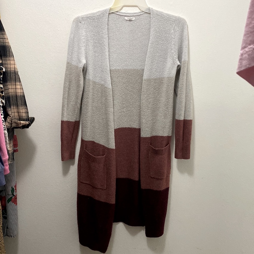Long knit Maurice’s cardigan. Oversized. Got an XS and I wear a M and it fits.